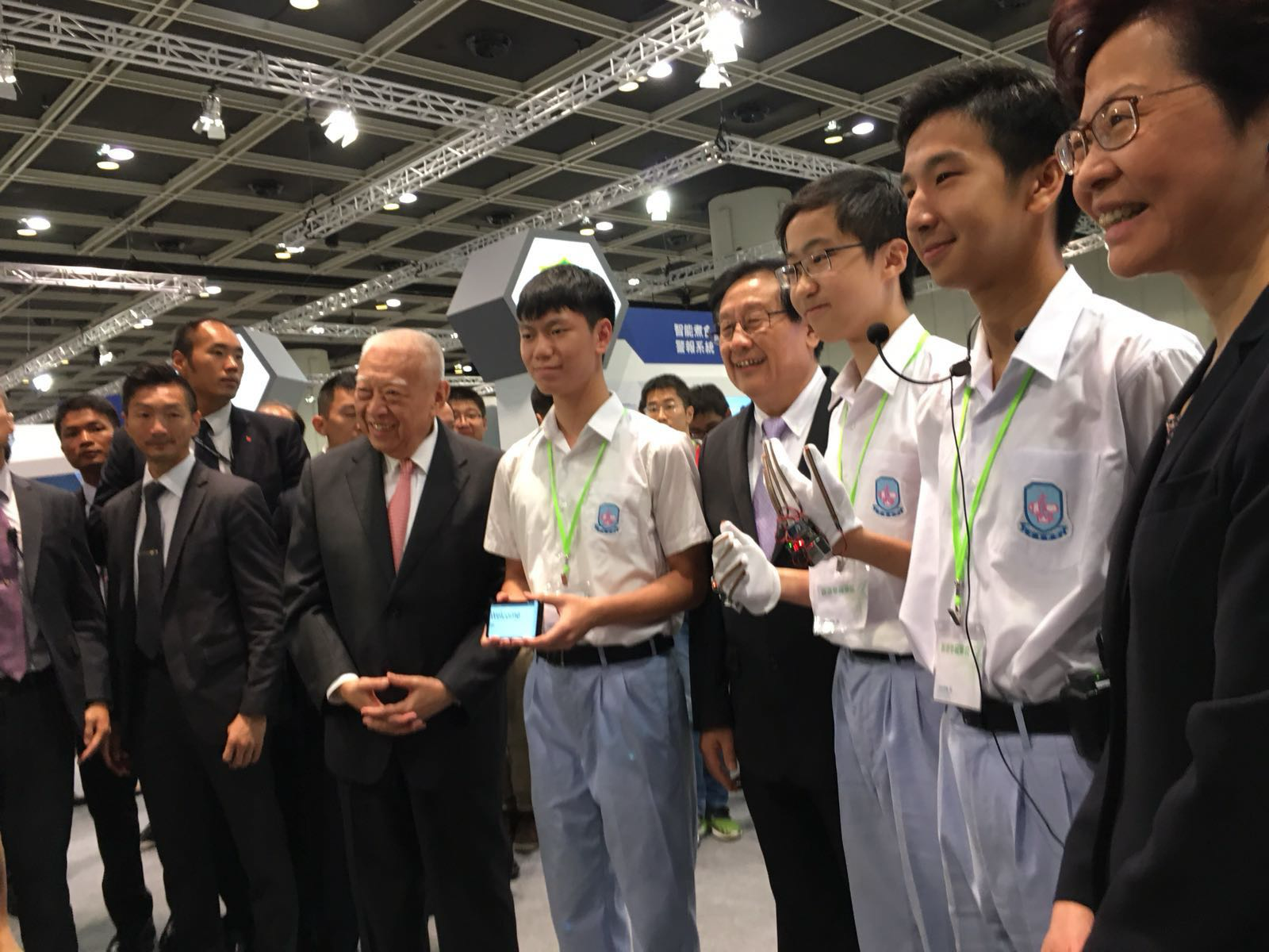 Demonstrating the gloves to visiting officials at the expo