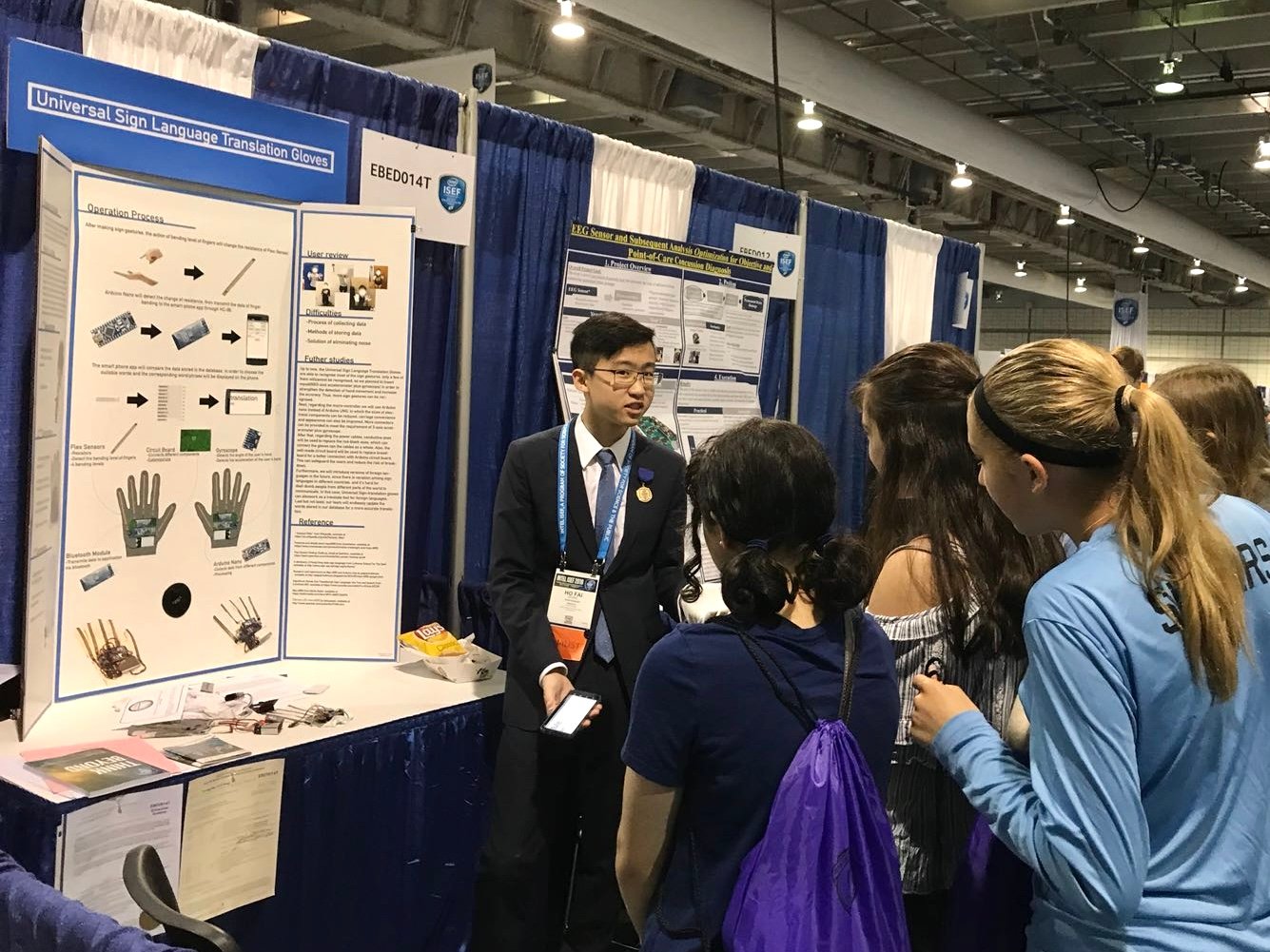 Presenting the gloves at the Intel ISEF booth